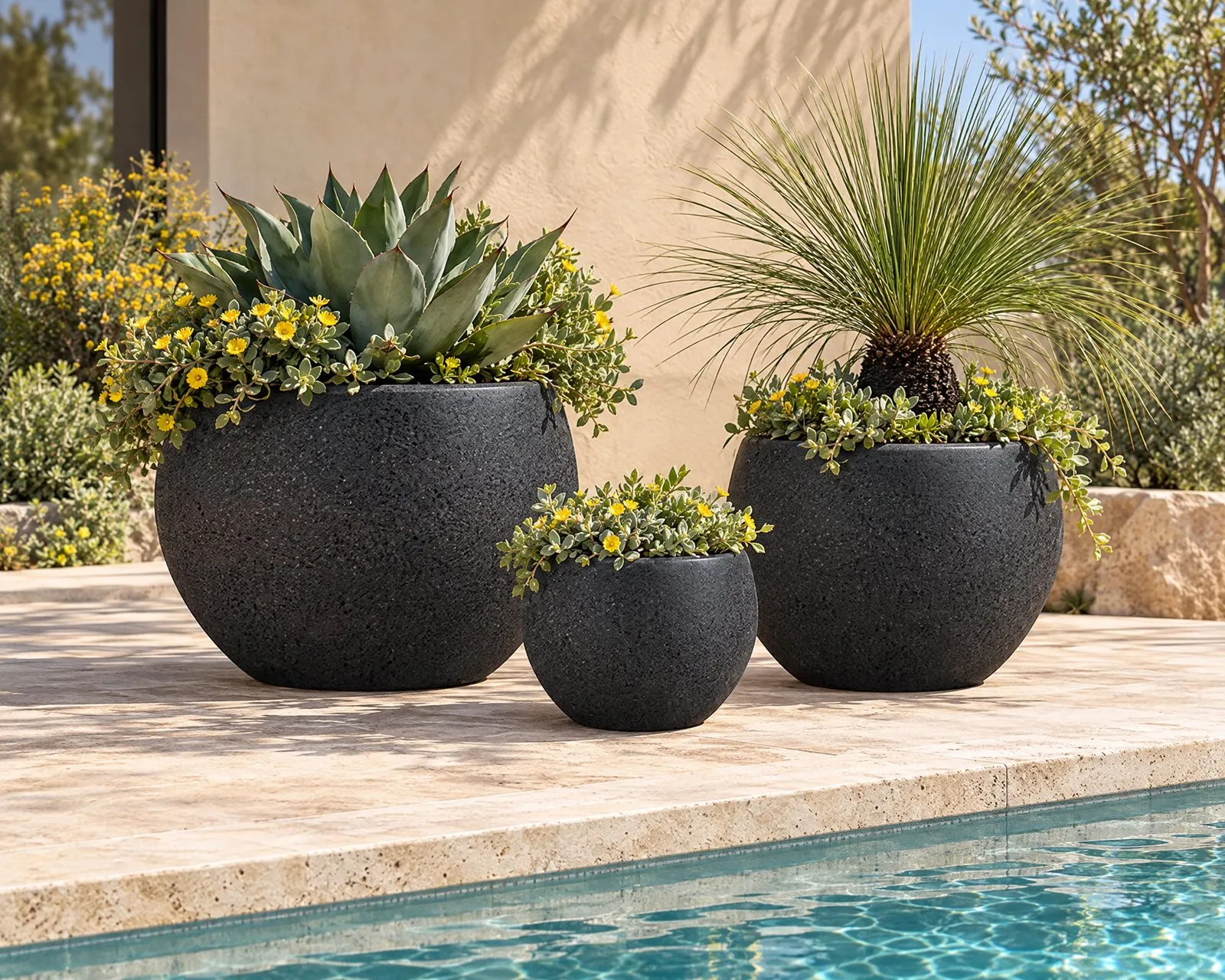 Aspen pots in Onyx beside a pool