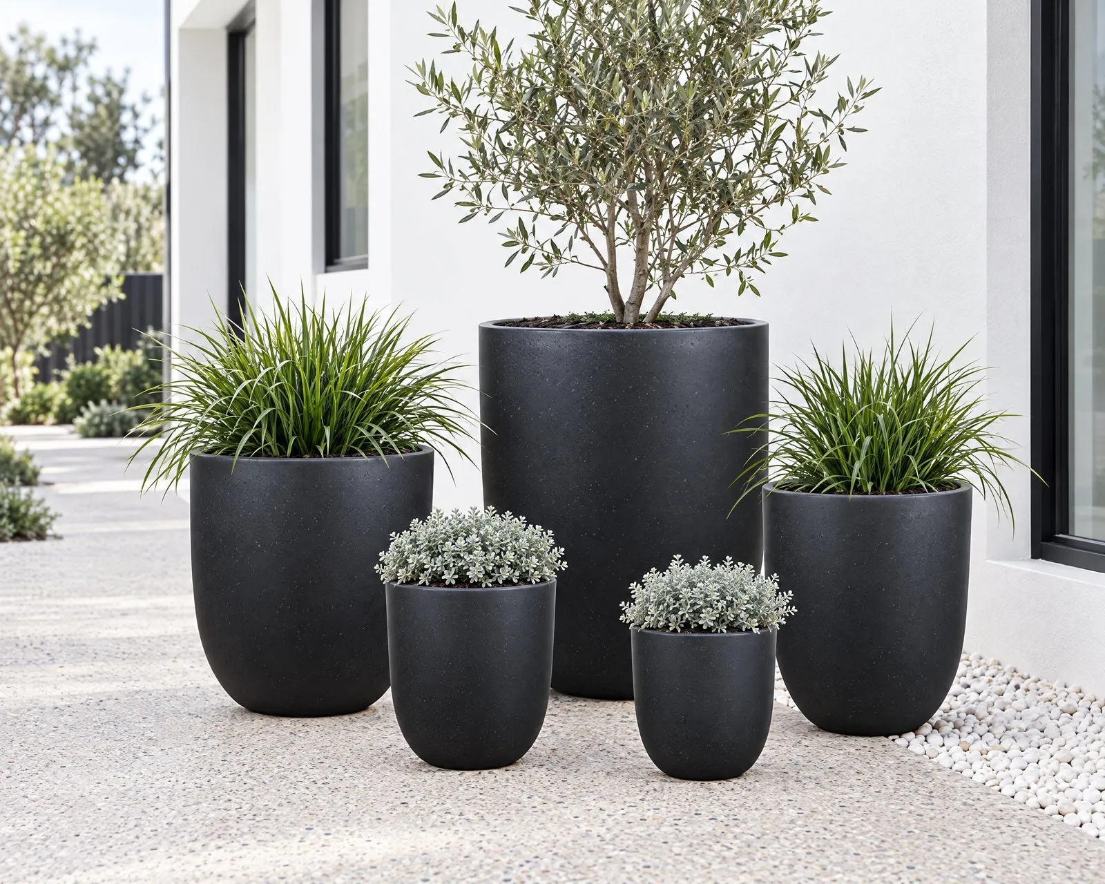 Havana pots in Charcoal beside a white rendered house