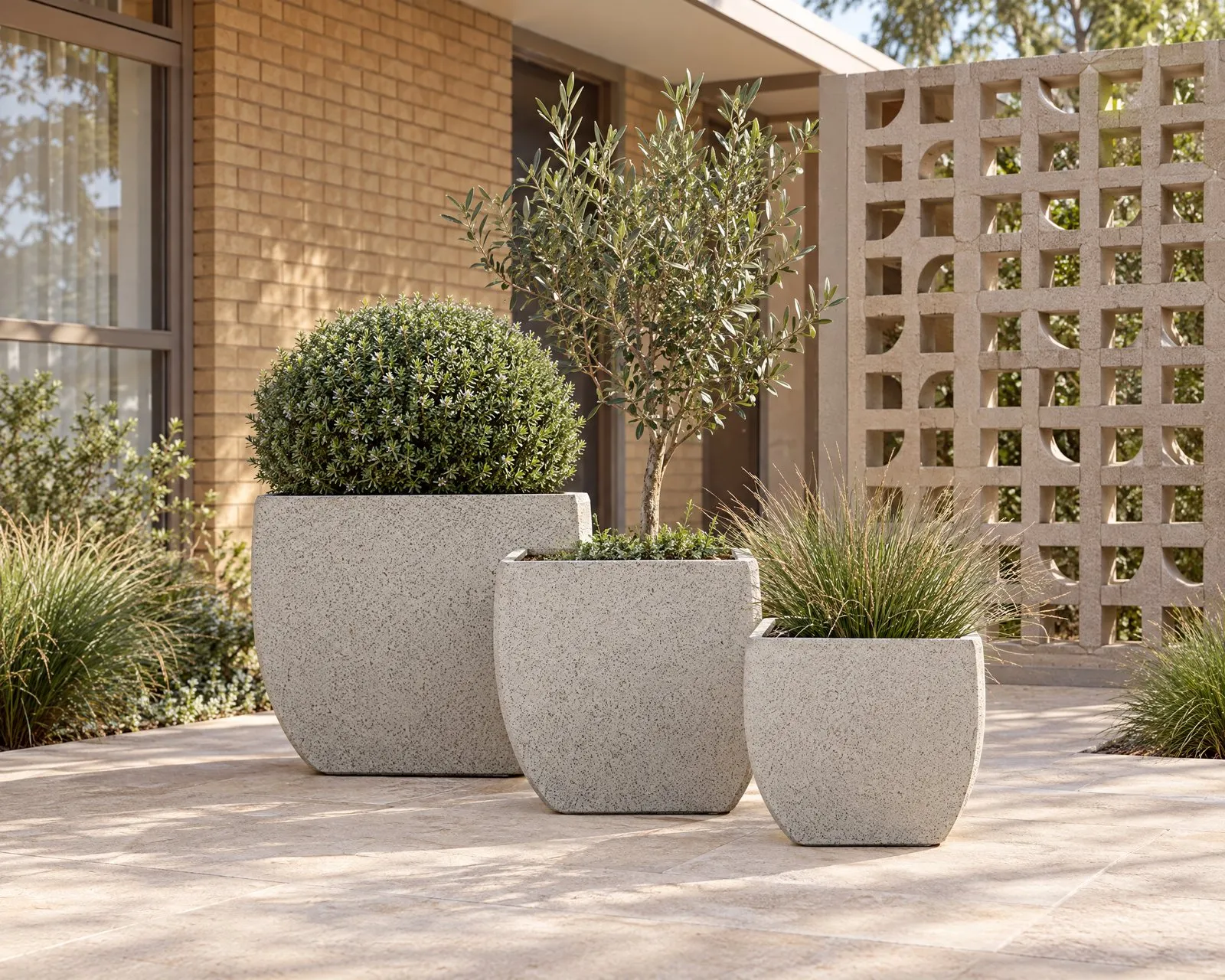 Kingston pots in Nougat in a brick courtyard