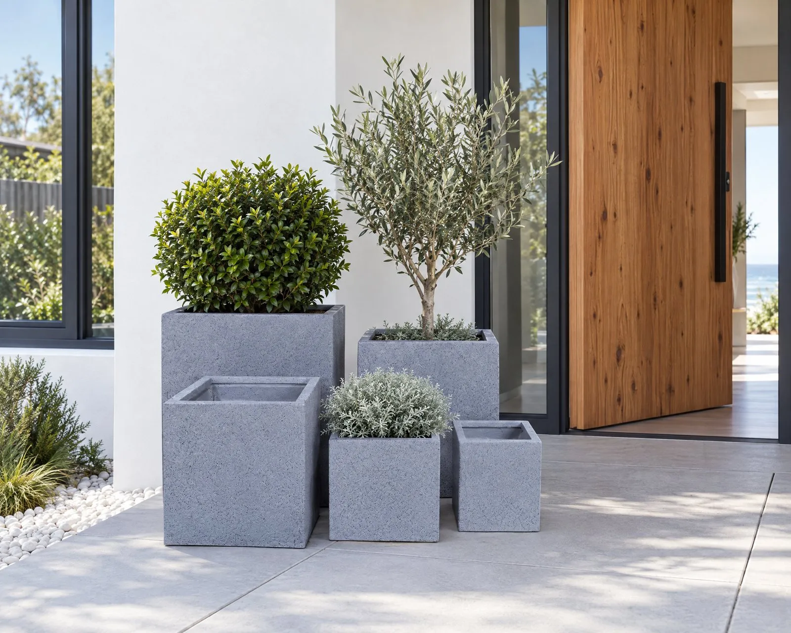 Monet pots in Granite at a white house entry