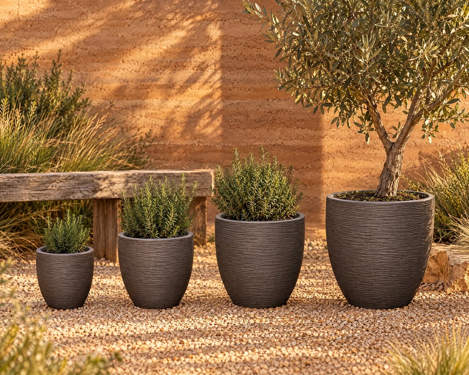 Tuscany pots in Espresso in front of a rammed earth wall